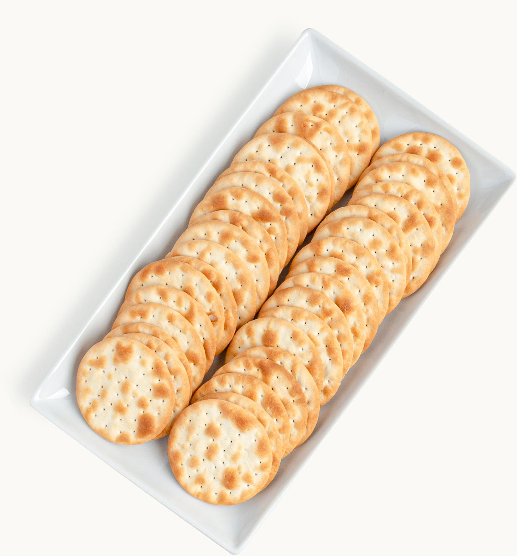 White crackers in a porcelain ramekin